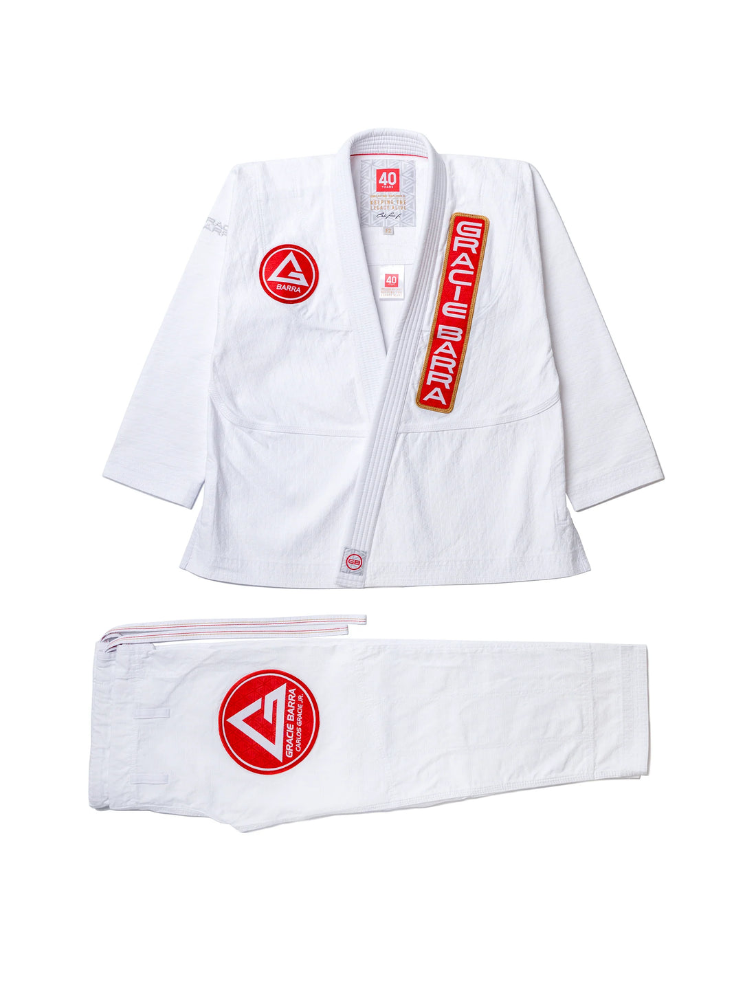 40 Year Anniversary Women's Kimono flat lay of jacket and pants with Barra Shield, Gracie Barra Patch, and Legacy G detail