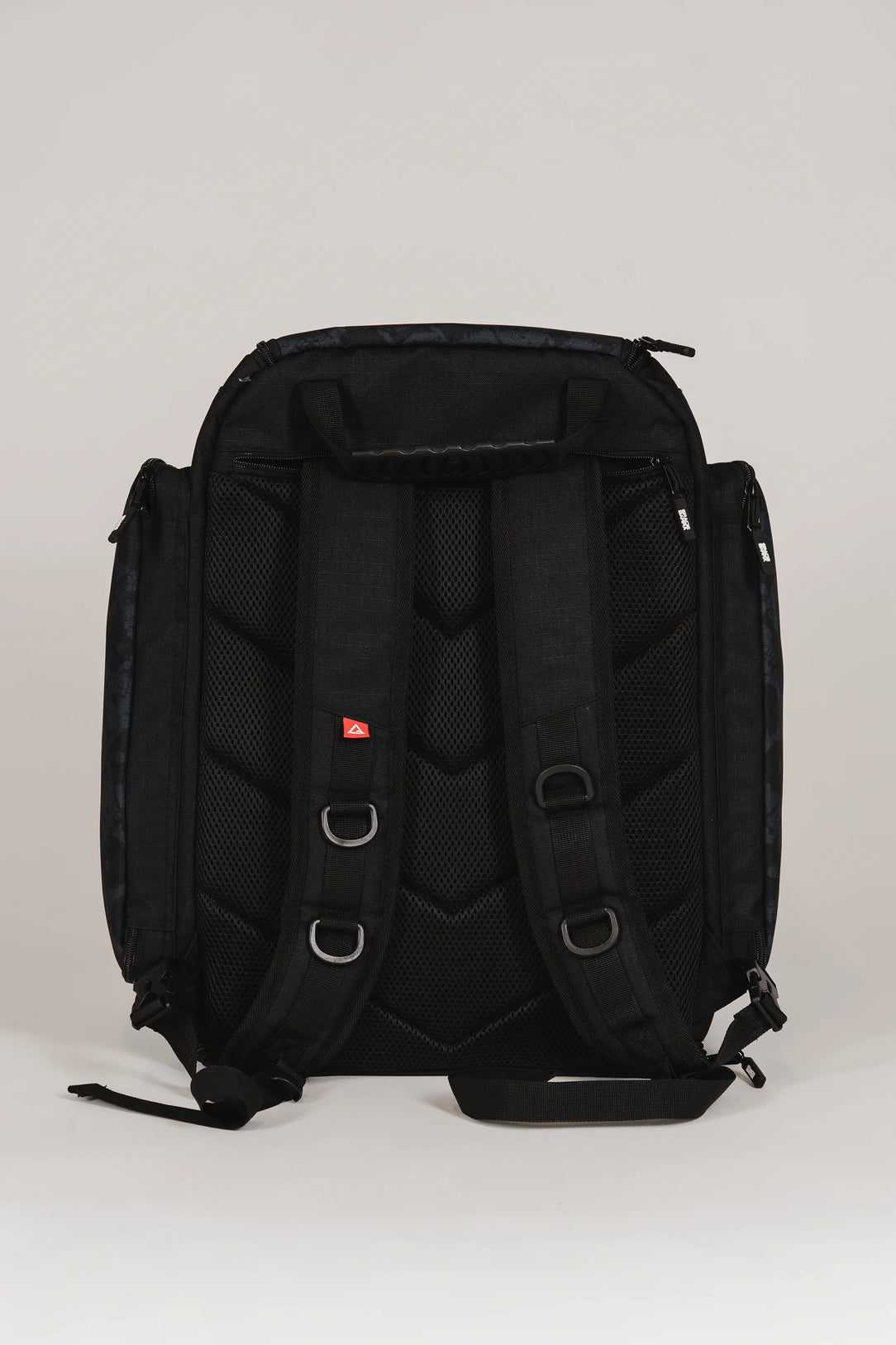 Back view of Black Barra da Tijuca Backpack showing padded shoulder straps, mesh ventilation panels, and reinforced stitching for ergonomic comfort and durability.
